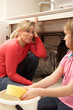 Daughter Helping Mother To Mop Up Leaking Sink