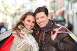 Photo: Happy couple doing shopping in town Happy couple doing shopping in town