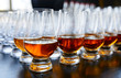Whisky or cognac in snifters, soft focus, amber-blue tone