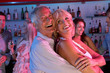 Senior Couple Having Fun In Busy Bar