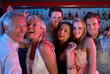 Group Of People Having Fun In Busy Bar