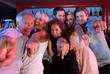 Group Of People Having Fun In Busy Bar