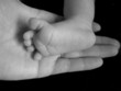 hand holding foot