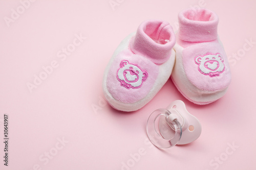 Photo: pink baby shoes and pacifier pink baby shoes and pacifier