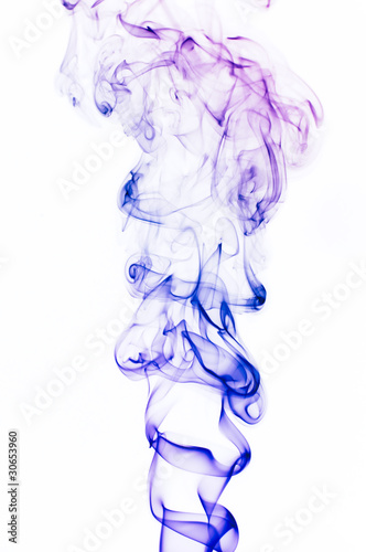 Photo: Multi-colored smoke on a white background. A close up. Multi-colored smoke on a white background. A close up.