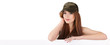 Portrait of an attractive smiling woman leaning on blank board