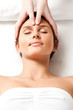 woman receiving face massage