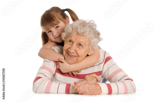Photo: The elderly woman with the grand daughter The elderly woman with the grand daughter