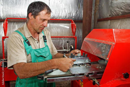 Photo: A man working on the machine A man working on the machine