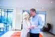 Happy couple embracing at home
