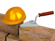 Trowel, bricks, yellow plastic helmet