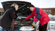 Foto: Woman getting a boost for her car Woman getting a boost for her car
