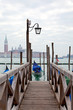 Foto: Gondola at the end of the bridge with blue cover Gondola at the end of the bridge with blue cover