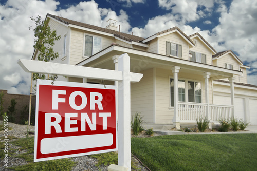 Photo: For Rent Real Estate Sign in Front of House For Rent Real Estate Sign in Front of House