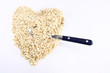 Heart shaped oatmeal with spoon