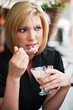 Young woman eating an ice cream