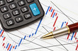 business graph and a magnifier