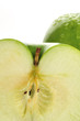 A half green apple isolated on a white background.
