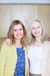 Smiling woman with adult daughter