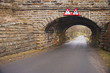 Old stone bridge over a country lane