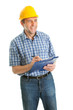 Worker wearing hard hat and taking notes