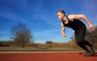 Young runner starting to sprint in park