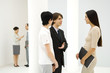 Photo: Young businessman introducing two business women to each other, smiling at each other Young businessman introducing two business women to each other, smiling at each other