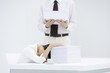 Photo: Woman with head down on desk, next to tall stack of papers, man holding another stack of paper Woman with head down on desk, next to tall stack of papers, man holding another stack of paper