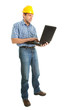 Worker wearing hard hat and using leptop