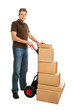 Photo: Delivery man with hand truck and stack of boxes Delivery man with hand truck and stack of boxes