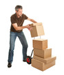 Photo: Delivery man staking packages on hand truck Delivery man staking packages on hand truck