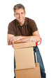 Photo: Delivery man with hand truck and stack of boxes Delivery man with hand truck and stack of boxes