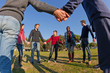 Multiracial Young People Holding Hands in a Circle