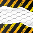 Wired fence behind ripped grunge paper Wired fence behind ripped grunge paper