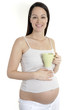 Relaxed pregnant woman holding mug
