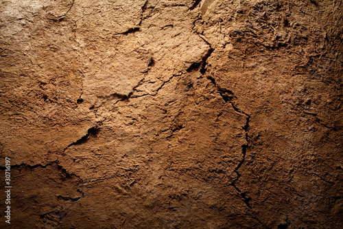Photo: Texture background - dry cracked brown earth Texture background - dry cracked brown earth