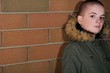 Photo: Teen Girl With Shaved Head Standing Against Brick Wall Teen Girl With Shaved Head Standing Against Brick Wall
