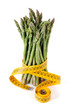 A bundle of green asparagus with measuring tape A bundle of green asparagus with measuring tape