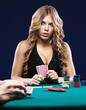 Foto: Woman doubt in a card gambling match Woman doubt in a card gambling match