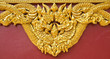 High relief sculpture, gold serpent