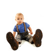 Little baby boy in father's shoes