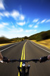 Photo: Bicycle rider with high speed view on the road Bicycle rider with high speed view on the road