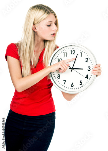 Photo: Young beautiful woman with the clock Young beautiful woman with the clock