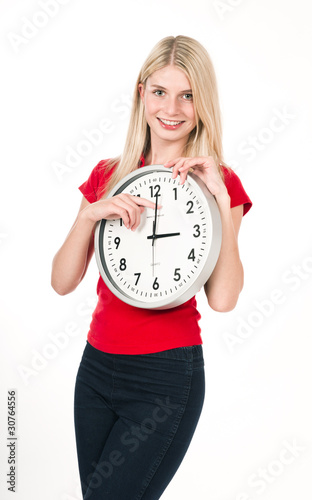 Photo: Blonde beautiful girl with the clock Blonde beautiful girl with the clock