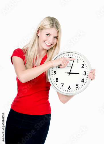 Photo: Blonde beautiful girl with the clock Blonde beautiful girl with the clock