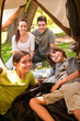 Joyful family camping in the park