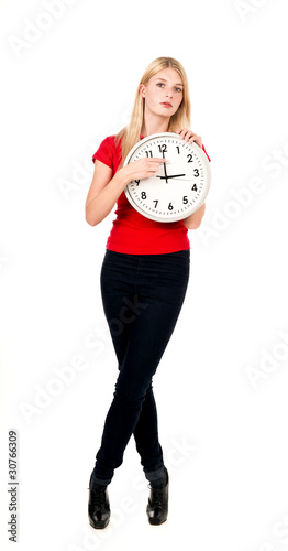 Photo: Young beautiful woman with the clock Young beautiful woman with the clock