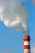 Smoking stack of the thermal power station against a blue sky
