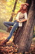 Young slim woman autumn portrait