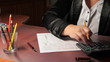 business woman fills out a 1040 tax form. slider shot. business woman fills out a 1040 tax form. slider shot.